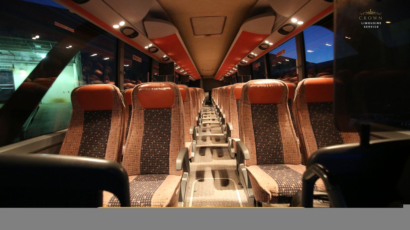 Interior shot of a vibrant party bus featuring colorful LED lighting, wrap-around leather seating, a built-in sound system, and a group of people dancing and enjoying the ride.