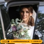 Luxury black town car decorated for a wedding outside a venue in Alexandria, VA